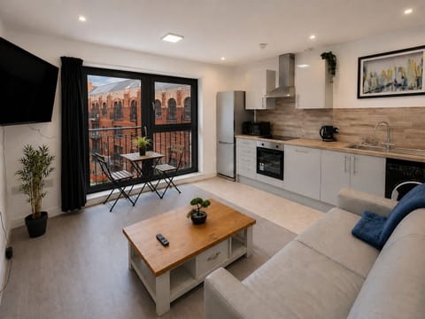 Business Apartment | Living area | Flat-screen TV
