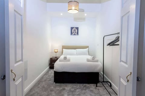 Enjoy this spacious bedroom with built-in cabinets for your clothes and essentials.