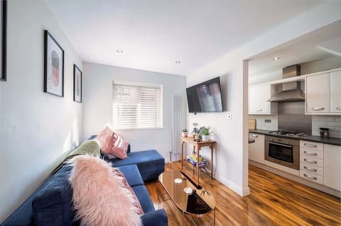 Spacious living area featuring a comfortable sofa bed, a Smart TV with Roku for streaming, as well as a selection of board games and books for relaxing entertainment