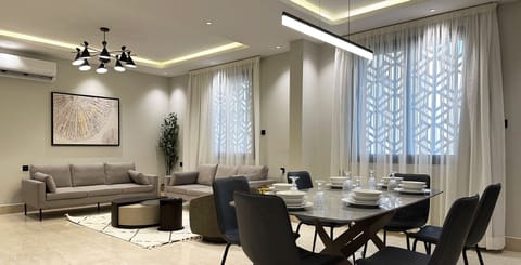 Design Apartment, 3 Bedrooms | Living area | Flat-screen TV