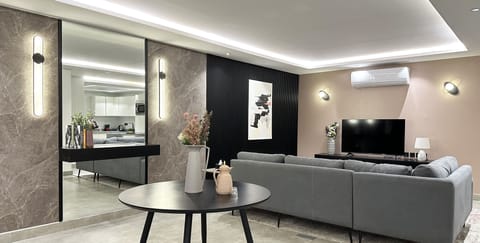 Design Apartment, 3 Bedrooms | Living area | Flat-screen TV