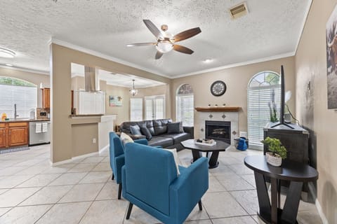 Spacious open-concept living with 65” smart TV.