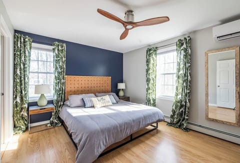 Bright and stylish bedroom with cozy bedding and large windows for natural light
A comfortable retreat designed for restful nights.