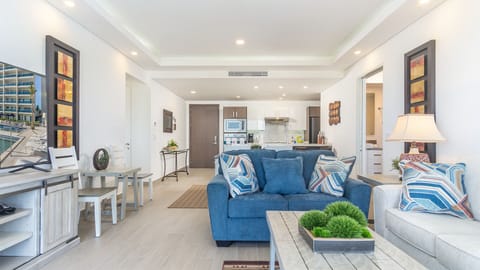 The living room flows past the dining room to the kitchen