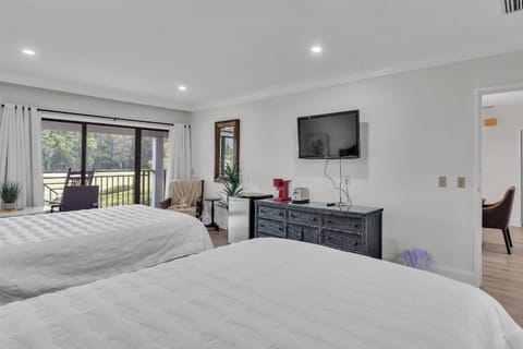 Studio with 2 Queen beds beckon in a cozy room equipped with a mini fridge, coffee maker, a toaster, and a TV!