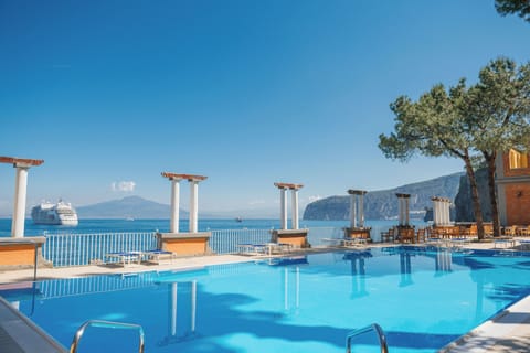 Seasonal outdoor pool, open 9:00 AM to 6:30 PM, pool umbrellas