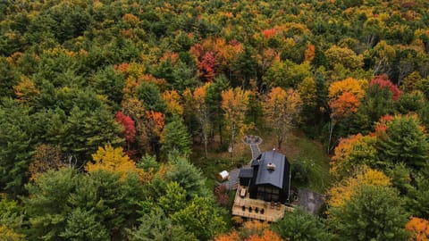 The Hideaway is nestled amidst a breathtaking backdrop of fall colors, where the vibrant reds, oranges, and golds of the surrounding trees create a stunning natural tapestry. As the leaves change, the landscape transforms into a picturesque scene, offering