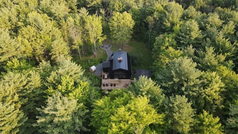 Secluded on 30 wooded acres, The Hideaway offers total privacy—plus a private outdoor spa with sauna and soaking tubs. Your summer escape, surrounded by nature.