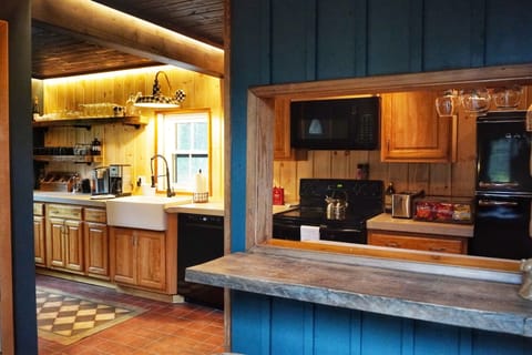 The Kitchen Bar is made from beautiful barnwood, this stylish space offers comfortable seating, perfect for casual dining or morning coffee. It's the perfect place to relax and chat while staying out of the kitchen during prep and making dinner.