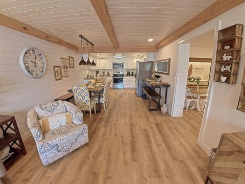 View of living room, dining room and kitchen from main entrance door.
