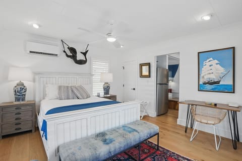 Walk in off the porch to this queen bedroom with desk, sitting chair - no door.