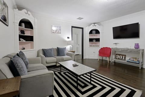 Unwind in the living room inspired by Priscilla Presley`s timeless elegance.