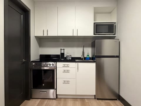 One-Bedroom Family Suite | Private kitchen | Fridge, microwave, coffee/tea maker