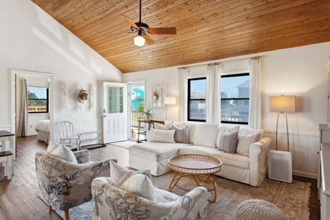 Relax in the beautiful Living Area with a Flat Screen TV and high ceilings!