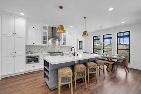 Sit at the Kitchen island or dining room table