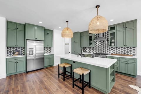 Cook in style with this charming green cabinetry