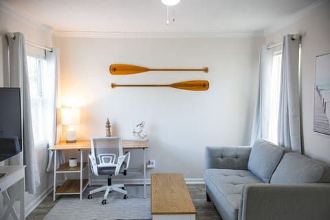 Hang out or get some work done in the living area that comes with a desk as well