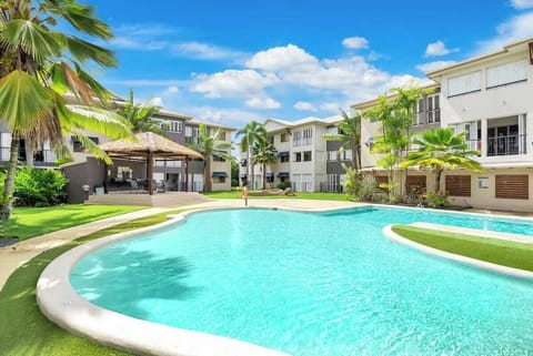 Dive into the shared pool, surrounded by lush greenery. It’s a tranquil haven where you can relax, sunbathe, or take a refreshing swim, perfect for unwinding and enjoying the tropical atmosphere.
