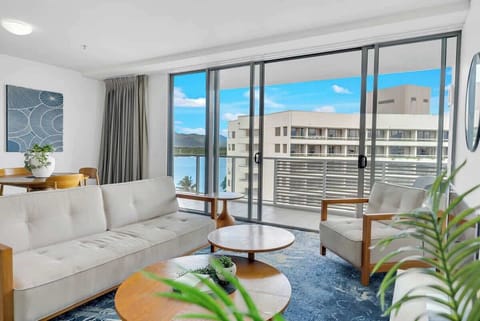 The living room provides a cosy retreat with ample seating, perfect for unwinding after a day of exploring the city.