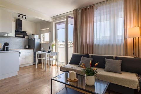 Comfortable Living Room with Sofa Bed and Smart TV | Book Now with RENTUJEMY