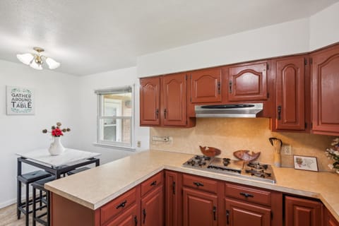 Indoors, Kitchen, Cooktop, Lamp, Desk