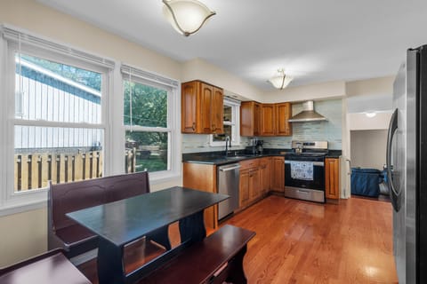 Spacious kitchen with granite countertops and ample cabinet space.