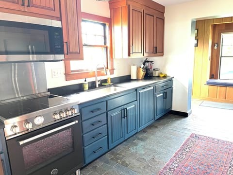 Induction range, microwave, and dishwasher.