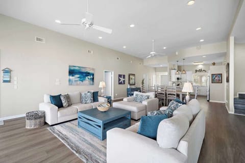 Bright living space with big, comfy sofas and plenty of natural light to enjoy.