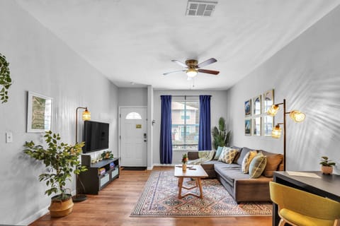 Stay productive and relaxed with our dedicated laptop-friendly workspace, featuring a stylish desk and comfortable seating just steps from the sofa.