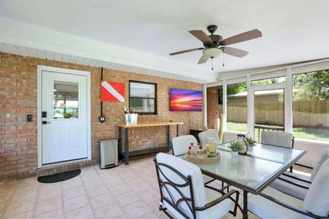 Entertain with ease in our spacious screened porch, ideal for gatherings and enjoying the beauty of the backyard.