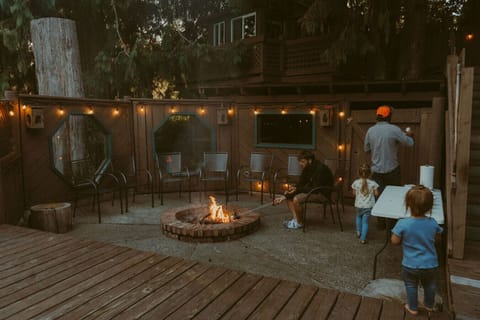 Cozy up by the enclosed fire pit and make some s`mores together.