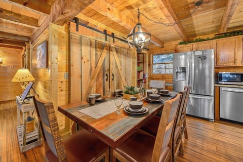 Dining table for 8 guests with 3 bar stools and the living room for family meals