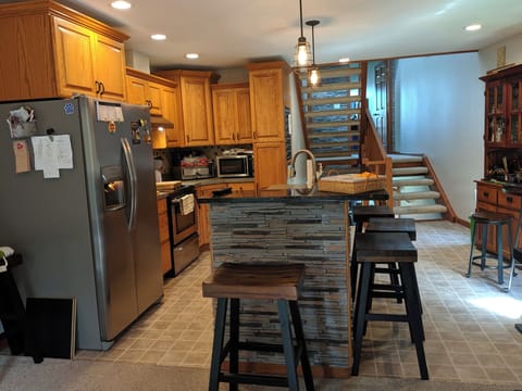 Kitchen area. 
Bar area. 
Pub table.
2nd living room area. 
Twin pullout couch.