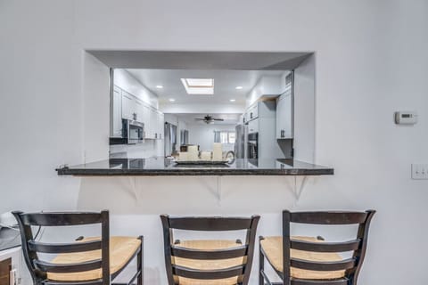 Seating at bar area with a view of the kitchen