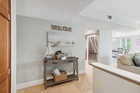 The open layout leads into a bright kitchen and dining area, creating a warm and welcoming first impression.