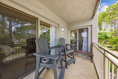 Adjacent to this inviting space is a cozy balcony offering picturesque views of the waterway.