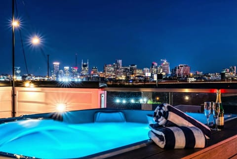 Champagne chilling poolside as the Nashville skyline glows at night from your private soak, this is how you celebrate with a group of 12