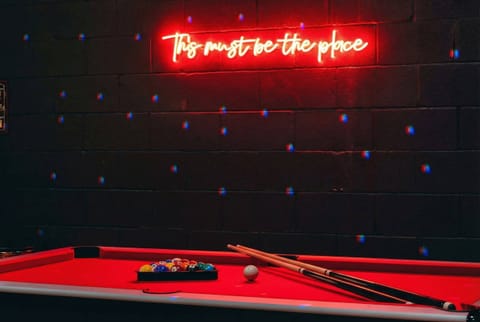 Unwind in style at this vibrant game room, where fun meets luxury! Perfect for friends and family, this is a prime spot for Nashville Group Vacation Rentals designed for bonding and laughs. Experience the excitement—book now with Misfit Homes!