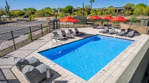 Pool deck with patio dining, loungers and BBQ