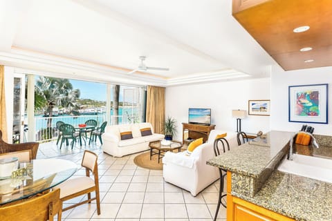 Open plan living, dining and kitchen overlooks the water - Yacht Club  C6 Provo