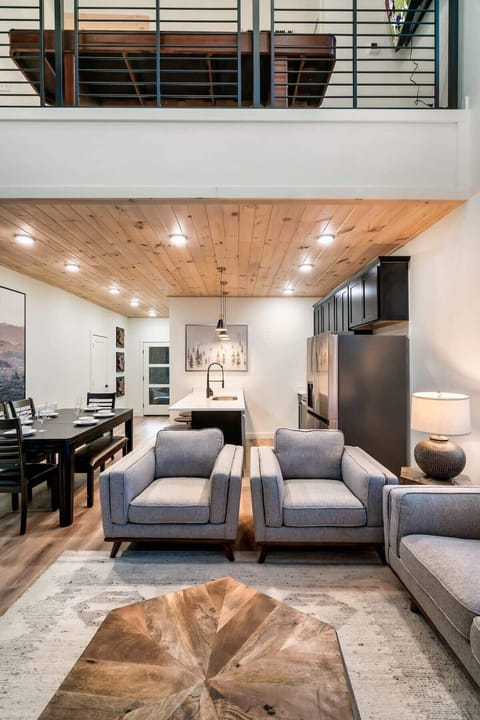 Spacious elegance with modern furnishings and a stunning wood ceiling accent!