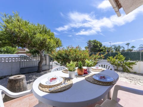 Sky, Cloud, Plant, Building, Property, Table, Furniture, Flowerpot, Tableware, Outdoor Furniture