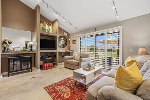 Inviting living room with warm tones, comfy seating, and plenty of natural light.