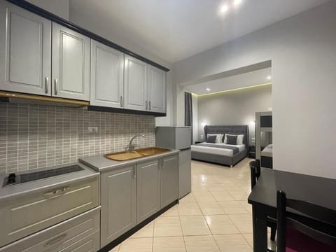 Deluxe Quadruple Room, Balcony, Lake View | Private kitchen | Fridge, stovetop, electric kettle, cookware/dishes/utensils