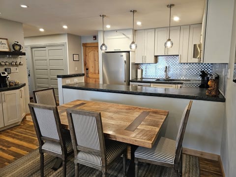 Dining area with 4 chairs and bench for 2