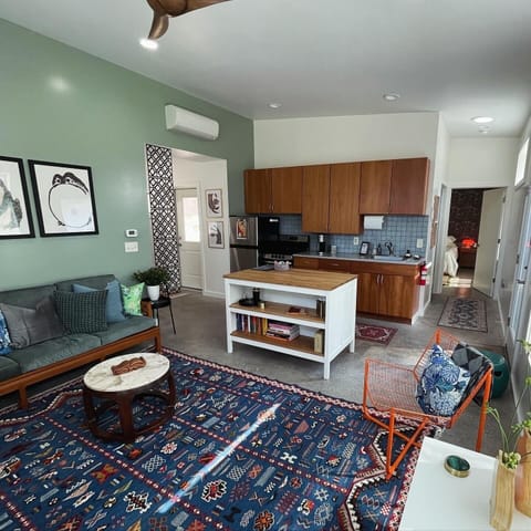 Living room with full kitchen