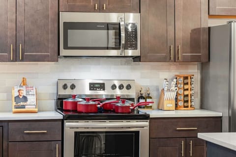 Prepare delicious meals in our fully equipped kitchen, featuring a modern stove, cookware, and all the essentials for your culinary needs.