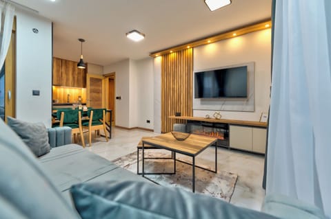 Family Apartment, Patio, Mountain View | Living area | 42-inch LCD TV with premium channels, heated floors