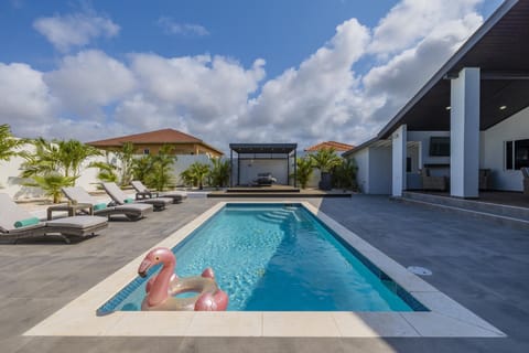 Dive into relaxation in our refreshing pool, surrounded by sun loungers and the inviting aroma of barbecue. Every moment here is a vacation dream come true.