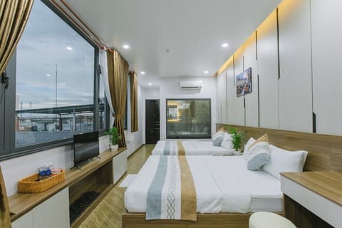 Panoramic Quadruple Room, City View | Minibar, iron/ironing board, free WiFi, bed sheets